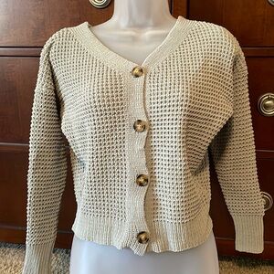 Women’s small sweater in a teal green color.